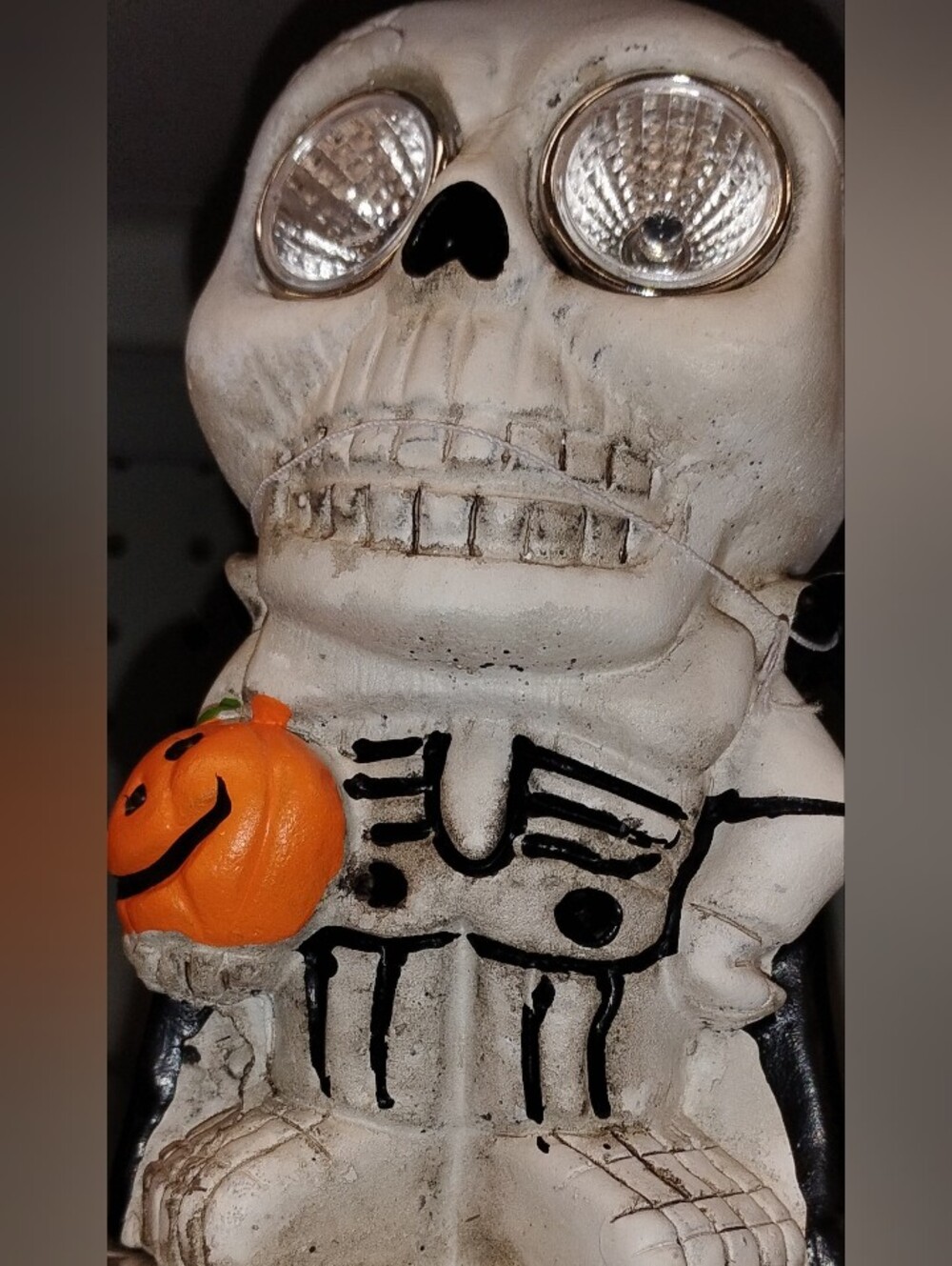 Festive Halloween White Skeleton Sculpture with Orange Pumpkin Accent